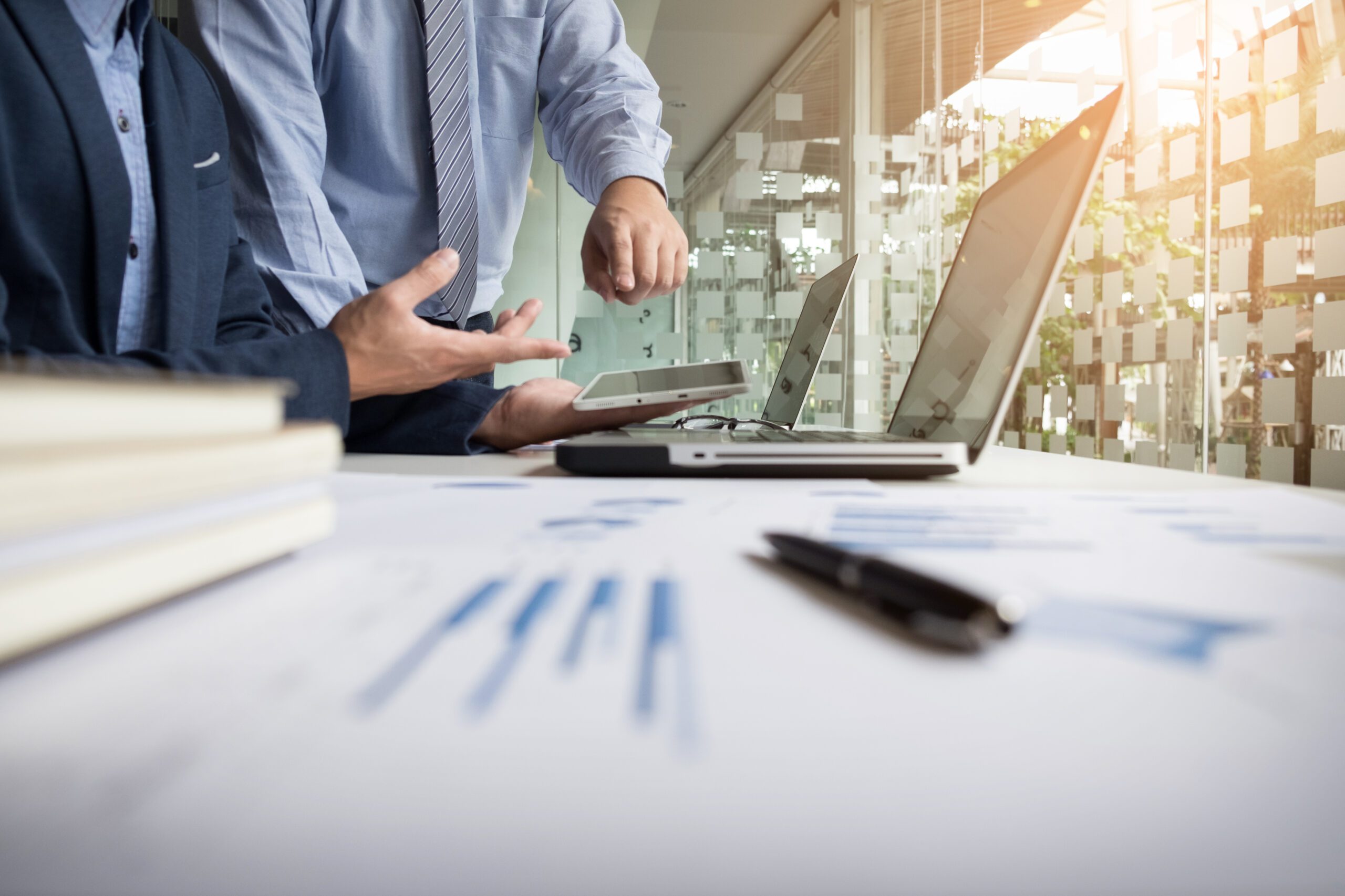 Business adviser analyzing financial figures denoting the progre Business adviser analyzing financial figures denoting the progress in the work of the company.